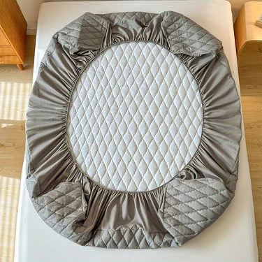 Protective waterproof fitted sheet for single, double, 140cm & 160cm beds. Soft, durable, and leak-resistant.