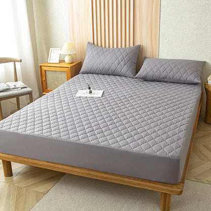 Protective waterproof fitted sheet for single, double, 140cm & 160cm beds. Soft, durable, and leak-resistant.